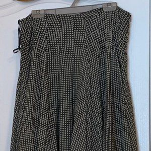 Black and white patterned flowing silk skirt.